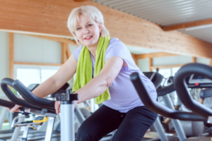 older woman exercising in gym
